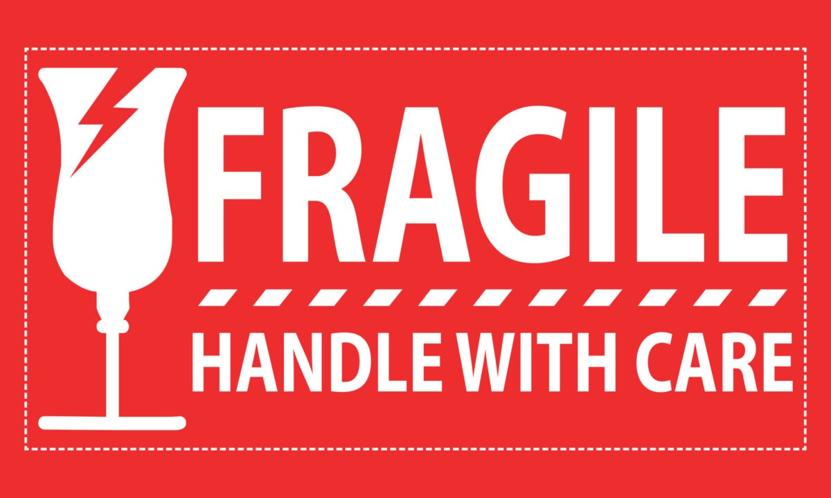 Fragile handle with care sticker, fragile label with broken glass symbol vector.